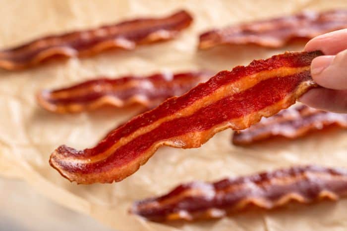 strips of turkey bacon, cooked, on parchment paper