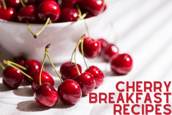 bowl of cherries with some on table with text overlay