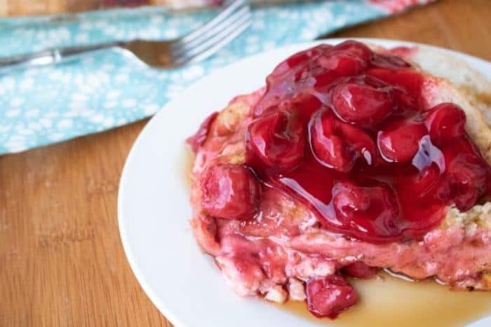 cherry french toast casserole on white plate
