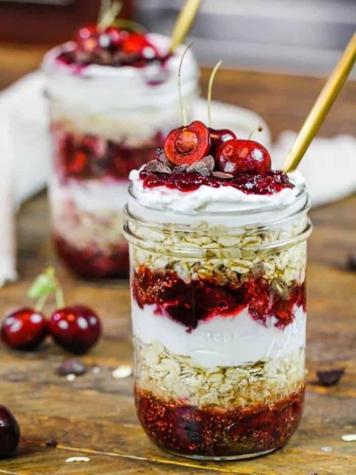 mason jars filled with cherry overnight oats
