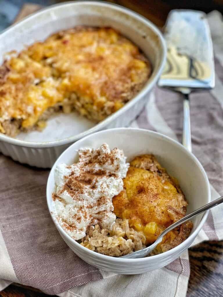 peach baked oatmeal in white bowl and baking dish