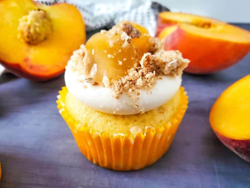 peach cobbler cupcake on gray background