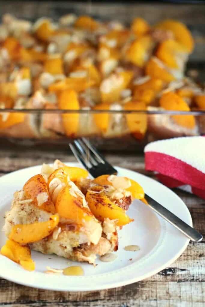 peach french toast bake - some on a white plate and the rest in a baking dish