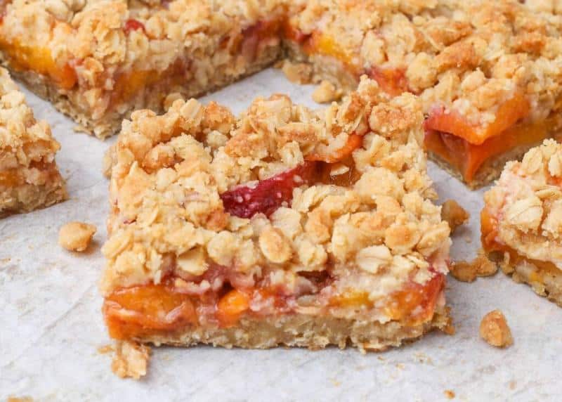 peach oatmeal bars on parchment paper