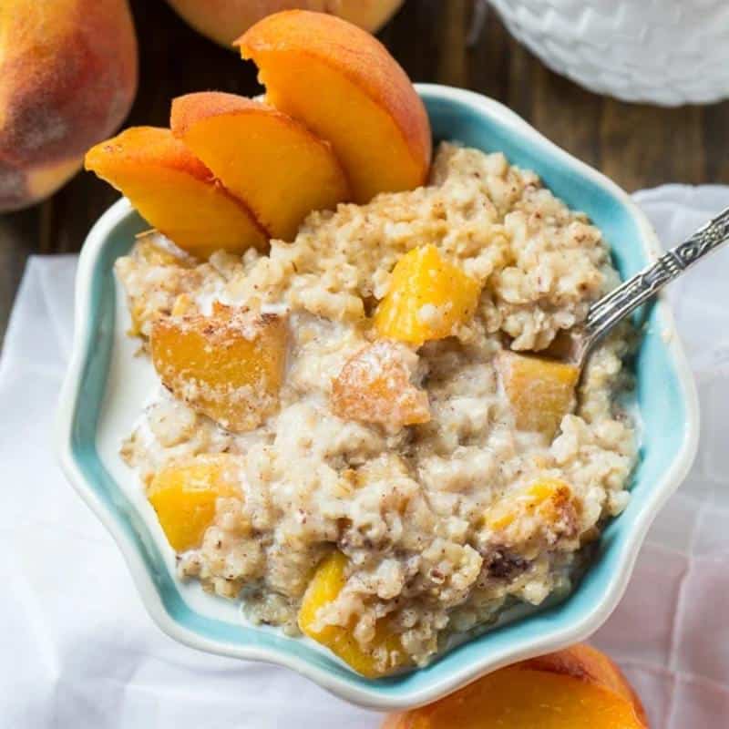 peaches and cream oatmeal in blue bowl