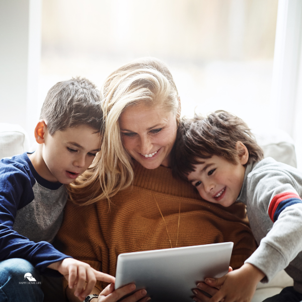 mom and kids using electronic device