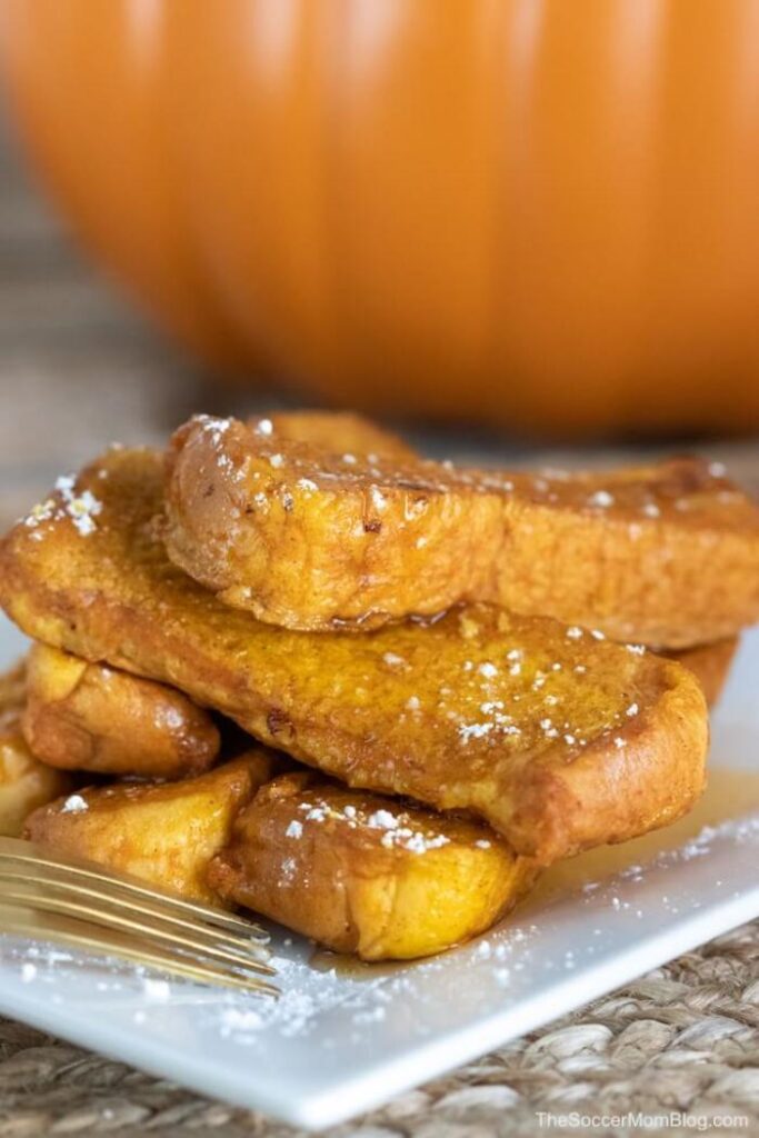 pumpkin french toast sticks on white plate