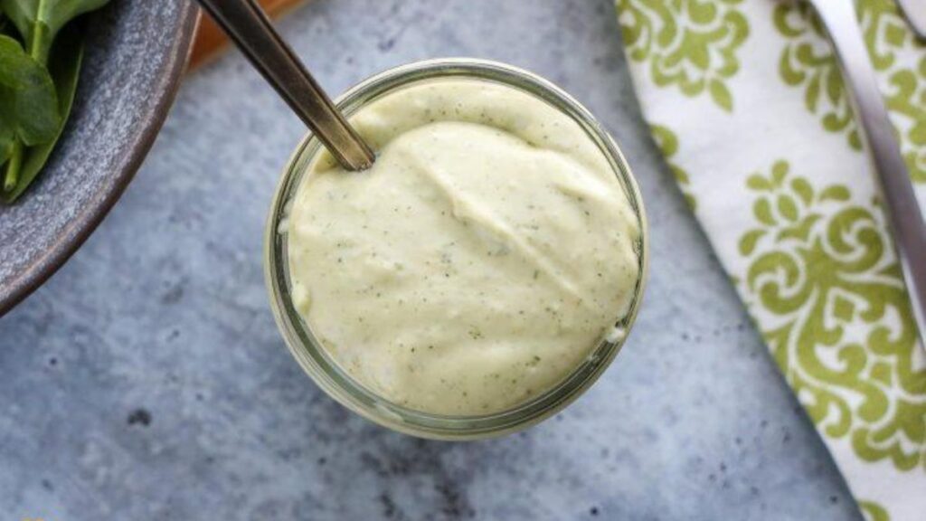 a jar of homemade avocado lime ranch dressing