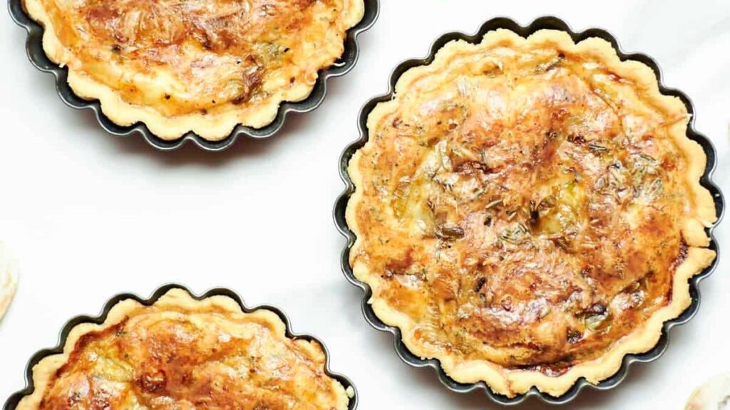 Double crust quiche filled with leeks, cheese and mushrooms