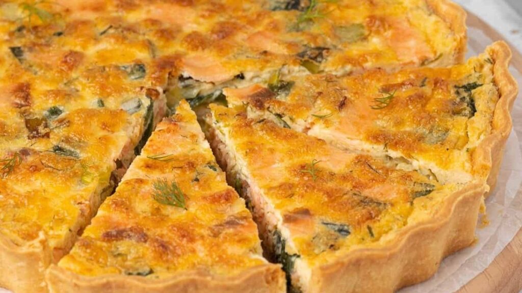 A quiche with leeks, salmon and cheese