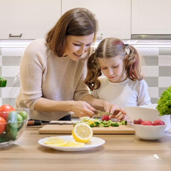 mother and kid cooking in a kitchen