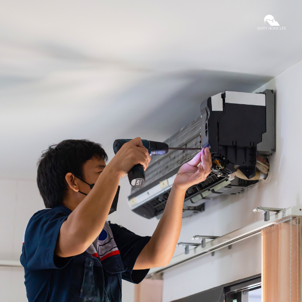 A technician installing an air conditioning unit on a wall, providing tips for creating a cool and comfortable space in each room of the home.