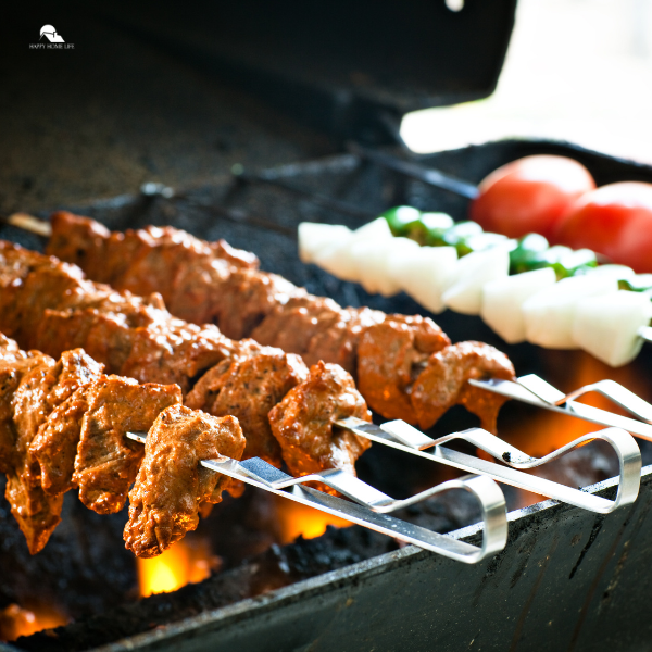 Grilled meat and vegetable skewers cooking on a grill, perfect for Backyard BBQ ideas and Summer party ideas with friends and family, essential for BBQ party planning.